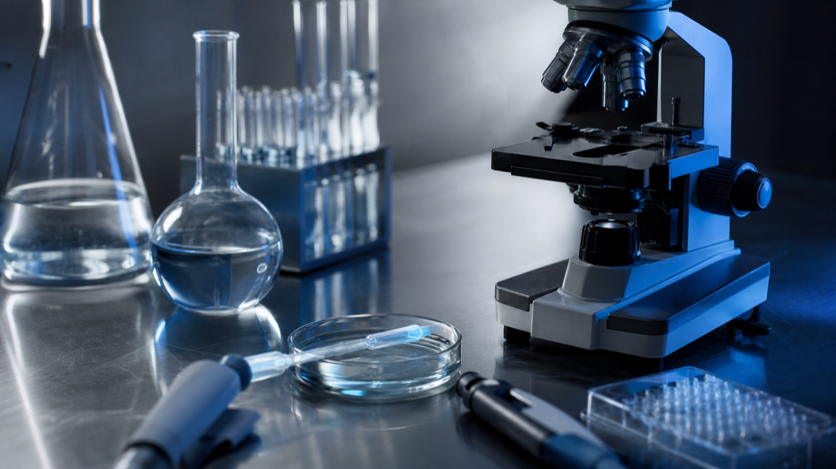 A research laboratory — the environment where Hassabis believes AGI will have its most immediate impact, accelerating drug discovery and materials science at a scale that human researchers cannot match.